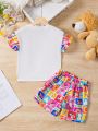 SHEIN Kids QTFun Little Girls' 2pcs Cute Lion Printed Short Sleeve T-Shirt And Cartoon Printed Shorts Set For Summer