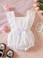 SHEIN Baby Eyelet Embroidery Ruffle Trim Bow Front Bodysuit