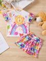 SHEIN Kids QTFun Little Girls' 2pcs Cute Lion Printed Short Sleeve T-Shirt And Cartoon Printed Shorts Set For Summer