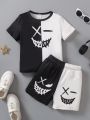 SHEIN Kids EVRYDAY Young Boys' Black & White Symmetrical Emoji Pattern Round Neck Short Sleeve T-Shirt And Shorts Set, Casual & Cute, Suitable For Summer