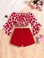 SHEIN Kids CHARMNG Tween Girl Love Heart Print Off Shoulder Top With Flare Sleeves And Solid Colored Shorts 2pcs/Set