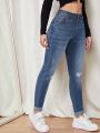 Women's Skinny Ripped Jeans With Water Washing Effect