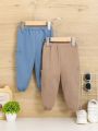 SHEIN Baby Boy 2pcs Dual Pocket Side Solid Pants