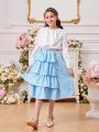 SHEIN Kids FANZEY Tween Girls' Irregular Ruffle Edge Decorated Button Long Sleeve Shirt And Decorated Button Layered Cake Skirt Two Piece Set