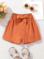 SHEIN Kids EVRYDAY Tween Girls' Woven Solid Color Loose Fit Casual Shorts