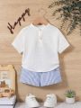 SHEIN Unisex Baby Half-Zip Short Sleeve Polo Shirt With Stand Collar And Blue & White Striped Casual Shorts Two Piece Set