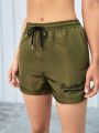 SHEIN Street Sport Letter Print Drawstring Waist Slant Pocket Sports Shorts