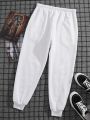 Men Letter Graphic Drawstring Waist Thermal Lined Sweatpants