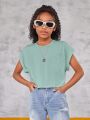 SHEIN Kids EVRYDAY Tween Girls' Knit Round Neck Solid Color Cropped Casual Short Sleeve T-Shirt