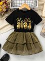 SHEIN Kids FANZEY Toddler Girls' Letter Printed Short Sleeve T-Shirt And Double-Layered Ruffle Hem Glitter Skirt 2pcs/Set