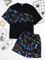 SHEIN Teen Boys' Casual Streetwear Style Night Light Digital Letter Printed Patchwork Short Sleeve T-Shirt And Shorts Set