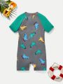 SHEIN 1pc Toddler Boys' Casual, Comfortable, Fashionable, Simple, Practical, Soft, Cute & Playful Dinosaur Pattern One-Piece Swimsuit With Color Blocking Sleeves, Suitable For Spring And Summer