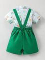 SHEIN Kids QTFun Young Boy's Cartoon Lion & Palm Tree Print Short Sleeve Shirt And Overalls Shorts Set