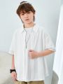 SHEIN Kids KDOMO Tween Boys' Casual Korean Style Turn-Down Knitted Jacquard Open-Front Loose Short Sleeve Shirt