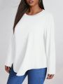 SHEIN LUNE Plus Size Solid Color Round Neck Asymmetrical Hem T-shirt