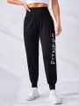 SHEIN Letter Graphic Wideband Waist Sports Pants With Phone Pocket