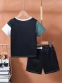 SHEIN Kids SPRTY Young Boy Color Block Letter Printed T-Shirt And Shorts With Drawstring, Casual 2pcs/Set Outfit