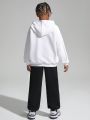 SHEIN Kids Cooltwn Big Boys' Casual Hooded Loose Fit Sweatshirt And Solid Color Knitted Pants Set With Cartoon Print, Spring/fall