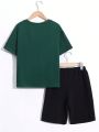 SHEIN Kids EVRYDAY Boys' Casual Streetwear Astronaut Printed Round Neck Short Sleeve T-Shirt And Shorts Knit Two Piece Outfit