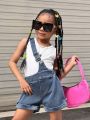 SHEIN Kids Y2Kool Young Girls' Summer Design Sense Casual Sleeveless Vest And Denim Shorts With Oblique Shoulder Strap Set