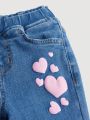 SHEIN Young Girl Heart Print Raw Hem Flare Leg Jeans