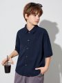 SHEIN Boys' Casual Lapel Super Loose Woven Open Placket Solid Color Short-sleeved Shirt