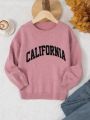 SHEIN Tween Girl Casual Loose Round Neck Pullover Sweater With Printed Text Detail