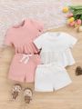 SHEIN Infant Girls' Casual Knitted Pure Color Short Sleeve Top And Elastic Waist Shorts Set (4pcs)