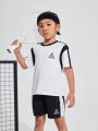 SHEIN Kids SPRTY Young Boys' Casual Loose Fit Round Neck Pullover Color Block T-Shirt And Shorts Set