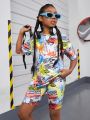 SHEIN Kids Cooltwn Teenage Girls' Fashionable Sporty Graffiti Printed Short Sleeve T-Shirt And Shorts Set With Round Neck