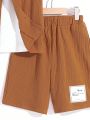 SHEIN Kids SUNSHNE Boys' Casual Solid Color Shorts & Woven Short-Sleeved Top Two-Piece Set, With Stick Decoration