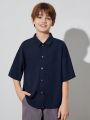 SHEIN Boys' Casual Lapel Super Loose Woven Open Placket Solid Color Short-sleeved Shirt