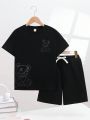 SHEIN Kids QTFun Tween Boys' Cute Bear Pattern Printed Short Sleeve Top And Shorts Knitwear Set