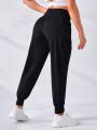 SHEIN Letter Graphic Wideband Waist Sports Pants With Phone Pocket