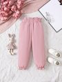 SHEIN Kids QTFun Little Girls' Solid Paper Bag Waist Casual Pants With Bowknot Detail And Color Blocking