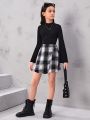 SHEIN Kids FANZEY Tween Girls' Knitted Solid Color Stand Collar Top And Knitted Plaid Skirt Set