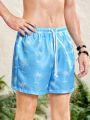 SHEIN Teenage Boys' Casual Coconut Tree Printed Loose Beach Shorts