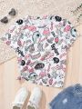 SHEIN Kids SUNSHNE Tween Girl Knitted Graffiti Letter Pattern Loose Fit Tee With Round Neck