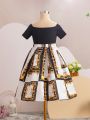 SHEIN Kids FANZEY Big Girls' Cross One Shoulder Short Sleeve T-Shirt With Baroque Print & Pleated Skirt Set