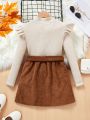 SHEIN Kids SUNSHNE Girls' Knitted Sweater With Stand Collar And Ruffle Hem Detailing Plus Corduroy Skirt Set