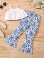 SHEIN Kids EVRYDAY Little Girls' Solid Color Spaghetti Strap Top & Full Print Bell Bottom Pants Casual Holiday Two Piece Set