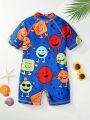 SHEIN Toddler Boys' Raglan Short Sleeved One Piece Swimsuit With Cartoon Print And Stitched Shorts