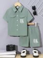 SHEIN Kids EVRYDAY Young Boy Alphabet Print Casual Turn-Down Collar Short Sleeve Shirt And Shorts 2pcs/Set