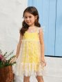 SHEIN Kids QTFun Young Girl Two Pieces Set Of Solid Color Spaghetti Strap Dress And Daisy Print Mesh Dress With Flying Sleeves