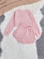 SHEIN Kids EVRYDAY Big Girls' Knitted Solid Color Sweater With Round Collar And Loose Short Style, Plus Knitted Solid Color Shorts With Pleats, 2pcs/set