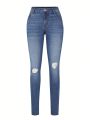 Women's Skinny Ripped Jeans With Water Washing Effect