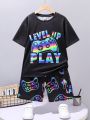 SHEIN Kids HYPEME Tween Boys' Casual And Trendy Night Light Game Console Printed Short Sleeve T-Shirt And Shorts Knitted Set