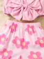 SHEIN Kids QTFun Little Girls' Cute Bowknot Strap Top And Flower Printed Shorts Two Piece Set