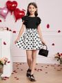 SHEIN Kids FANZEY Tween Girls' Round Neck Ruffle Knitted Tee With Detachable Heart Print Waist Belt And Skirt Set