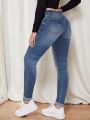 Women's Skinny Ripped Jeans With Water Washing Effect